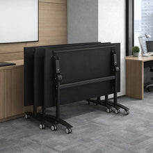 Load image into Gallery viewer, A set of folding flip top tables stacked away into storage
